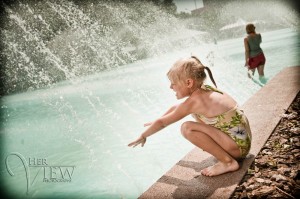 EdmontonPhotoWalk-09 City Hall Pool Girl Playing in water at Edmonton City Hall Pool